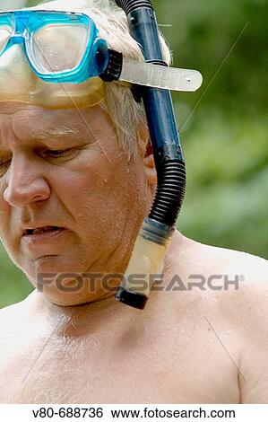 Man age 63 wearing snorkeling equipment Danbury Wisconsin USA View Large Photo Image Stock Photograph - Man age 63 wearing snorkeling equipment Danbury Wisconsin USA. Fotosearch