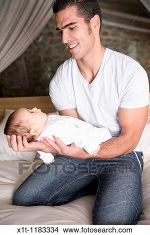Man and baby. View Large Photo Image Picture - Man and baby.. Fotosearch