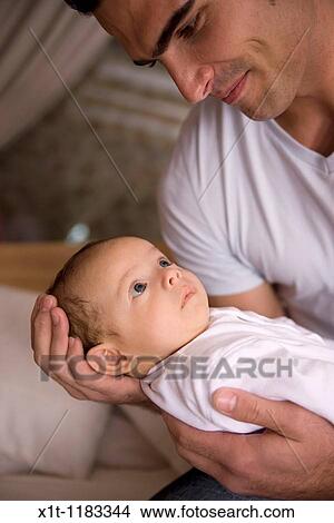 Man and baby. View Large Photo Image Picture - Man and baby.. Fotosearch