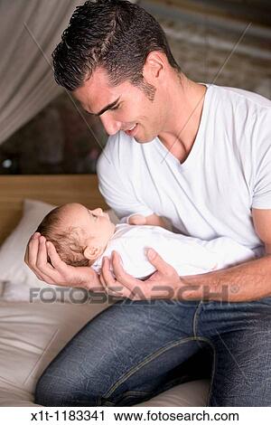 Stock Image - Man and baby.. Fotosearch