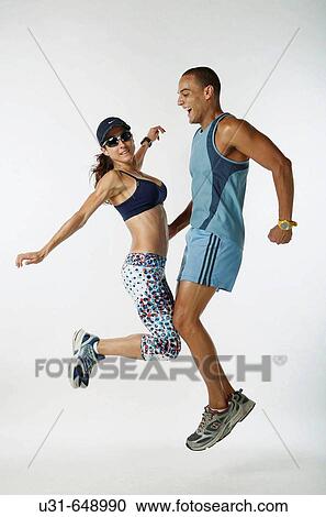 Man and Woman athletes jump in the studio View Large Photo Image Stock Image - Man and Woman athletes jump in the studio. Fotosearch