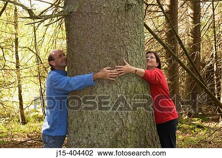 Man and woman grasping spruce. Bavarian Forest National Park. Germany View Large Photo Image Stock Image - Man and woman grasping spruce. Bavarian Forest National Park. Germany. Fotosearch