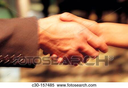 Man and woman shake hands View Large Photo Image Stock Photography - Man and woman shake hands. Fotosearch