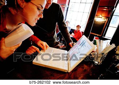 Man and woman with laptop in a pub. London. England View Large Photo Image Stock Image - Man and woman with laptop in a pub. London. England. Fotosearch