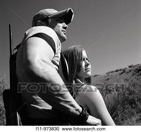 Man and woman with rifle; rural. View Large Photo Image Stock Image - Man and woman with rifle; rural.. Fotosearch