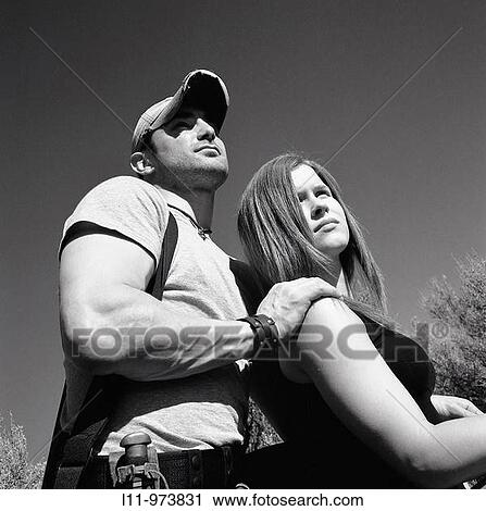 Man and woman with rifle; rural. View Large Photo Image Stock Image - Man and woman with rifle; rural.. Fotosearch