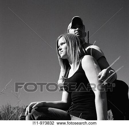Man and woman with rifle; rural. View Large Photo Image Stock Image - Man and woman with rifle; rural.. Fotosearch
