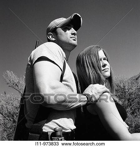 Man and woman with rifle; rural. View Large Photo Image Stock Image - Man and woman with rifle; rural.. Fotosearch