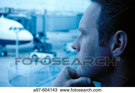 Stock Image - Man at airport. Fotosearch