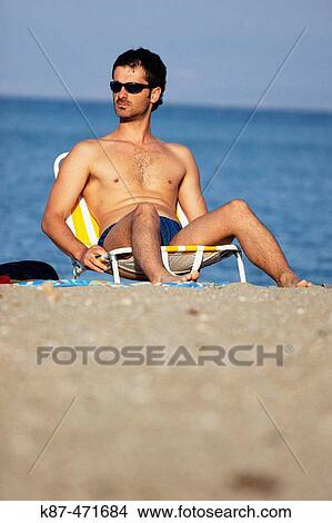 Man at beach. Greece View Large Photo Image Picture - Man at beach. Greece. Fotosearch