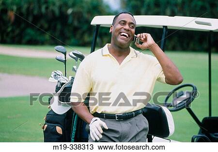 Man at golf course on cellular View Large Photo Image Stock Image - Man at golf course on cellular. Fotosearch