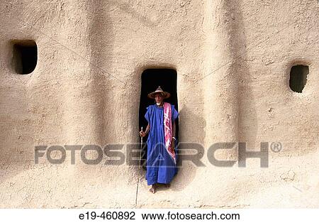 Man at mud mosque, Djenne. Mali View Large Photo Image Stock Image - Man at mud mosque, Djenne. Mali. Fotosearch