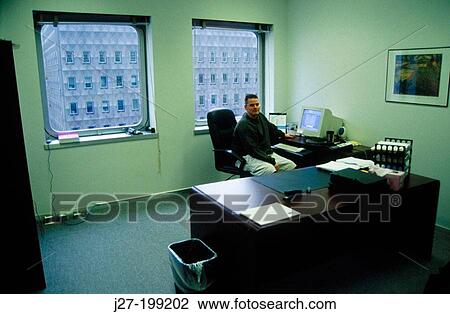 Man at office desk View Large Photo Image Stock Image - Man at office desk. Fotosearch