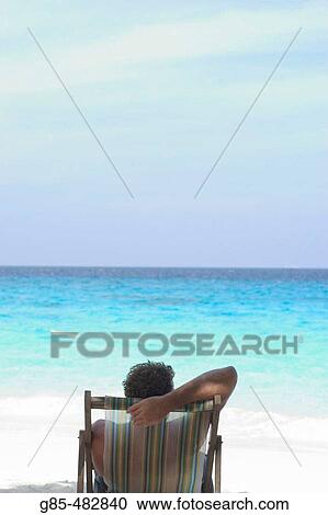 Man at the beach View Large Photo Image Stock Image - Man at the beach. Fotosearch