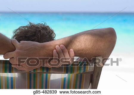 Man at the beach View Large Photo Image Stock Photo - Man at the beach. Fotosearch