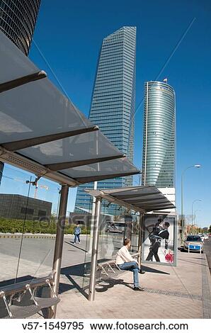 Man at the bus stop nearby Cuatro Torres Business Area. Madrid, Spain. View Large Photo Image Stock Photography - Man at the bus stop nearby Cuatro Torres Business Area. Madrid, Spain.. Fotosearch