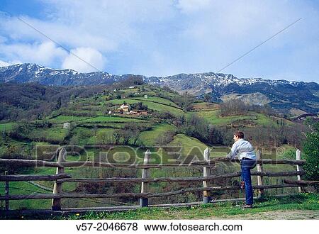 Stock Photo - Man at the viewpoint. Monte Gamonal, Asturias, Spain.. Fotosearch