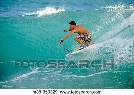 Stock Photo - Man boogie boarding in Kauai. USA. Fotosearch