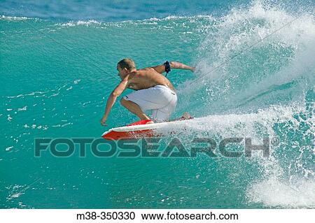 Man boogie boarding. Shipwreck Beach, Poipu area. Kauai. Hawaii. USA View Large Photo Image Stock Image - Man boogie boarding. Shipwreck Beach, Poipu area. Kauai. Hawaii. USA. Fotosearch