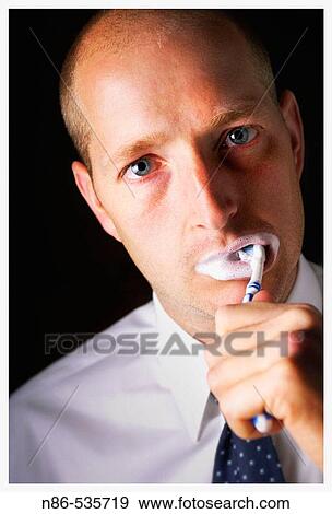 Man brushing teeth View Large Photo Image Stock Photo - Man brushing teeth. Fotosearch
