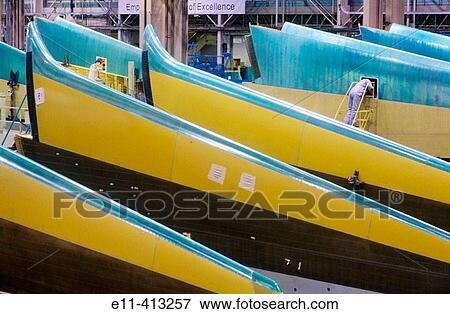 Man building commercial airplane sections View Large Photo Image Stock Photo - Man building commercial airplane sections. Fotosearch