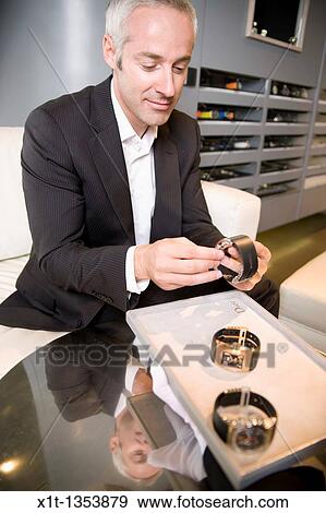 Man buying a wristwatch View Large Photo Image Stock Photo - Man buying a wristwatch. Fotosearch