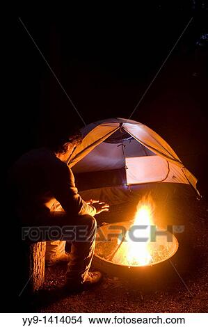 Man by campfire at South Whidbey State Park, Whidbey Island, Washington View Large Photo Image Picture - Man by campfire at South Whidbey State Park, Whidbey Island, Washington. Fotosearch