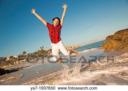 Man Celebrating On Beach View Large Photo Image Stock Image - Man Celebrating On Beach. Fotosearch