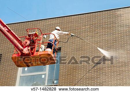 Man cleaning a facade. Madrid, Spain. View Large Photo Image Stock Photo - Man cleaning a facade. Madrid, Spain.. Fotosearch