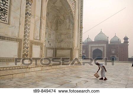 Man cleaning arownd Taj Mahal, Built by Shah Jahan in memory of Mumtaz Mahal his wife View Large Photo Image Picture - Man cleaning arownd Taj Mahal, Built by Shah Jahan in memory of Mumtaz Mahal his wife. Fotosearch