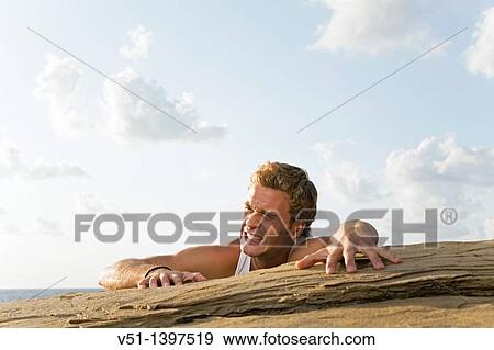 Man climbing in Ibiza, Balearic Islands View Large Photo Image Stock Photo - Man climbing in Ibiza, Balearic Islands. Fotosearch