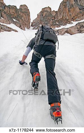Picture - Man climbing the Petzoldt Couloir on Mount Heyburn high in the Sawtooth Mountains of central Idaho. Fotosearch