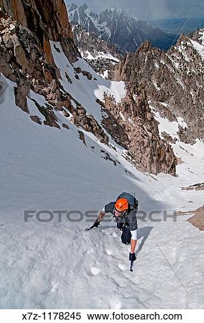 Man climbing the Petzoldt Couloir on Mount Heyburn high in the Sawtooth Mountains of central Idaho View Large Photo Image Stock Photography - Man climbing the Petzoldt Couloir on Mount Heyburn high in the Sawtooth Mountains of central Idaho. Fotosearch
