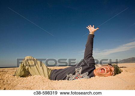 Man Coming Out of a Ditch View Large Photo Image Stock Photo - Man Coming Out of a Ditch. Fotosearch