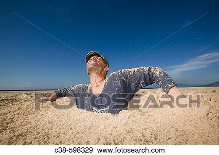 Man Coming Out of a Ditch View Large Photo Image Stock Photo - Man Coming Out of a Ditch. Fotosearch