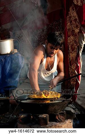 Man cooking in the street, Pushkar, Rajasthan, India View Large Photo Image Stock Image - Man cooking in the street, Pushkar, Rajasthan, India. Fotosearch