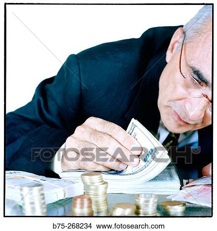 Man counting money View Large Photo Image Picture - Man counting money. Fotosearch