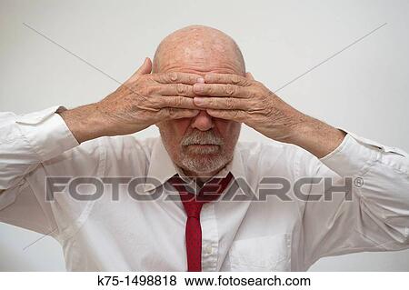 Man covering his eyes View Large Photo Image Stock Photo - Man covering his eyes. Fotosearch