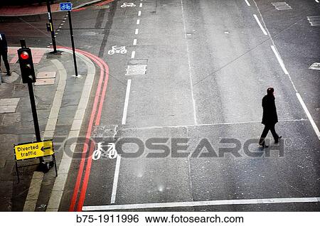 man crossing the street in the city of London, England, UK View Large Photo Image Stock Photograph - man crossing the street in the city of London, England, UK. Fotosearch