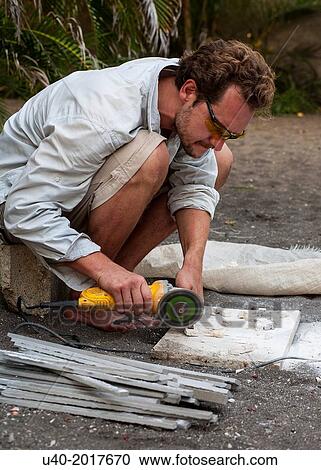 Man cutting tile. View Large Photo Image Stock Image - Man cutting tile.. Fotosearch