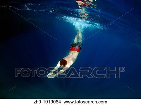 Picture - Man diving, Cleopatra island Sedir Island, Aegean Sea, Turkey. Fotosearch