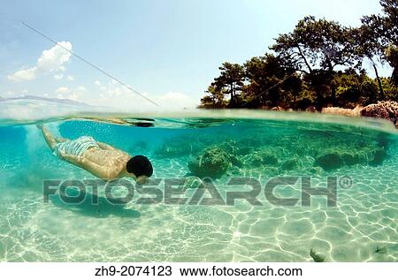 Man diving, Cleopatra island (Sedir Island), Aegean Sea, Turkey,. View Large Photo Image Stock Image - Man diving, Cleopatra island (Sedir Island), Aegean Sea, Turkey,.. Fotosearch