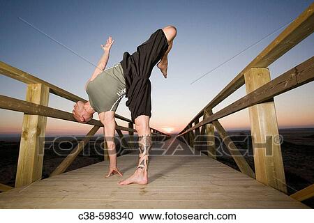 Man Doing Exercise on Footbridge View Large Photo Image Stock Image - Man Doing Exercise on Footbridge. Fotosearch