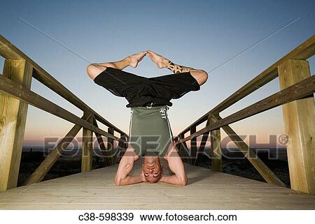 Man Doing Headstand on Footbridge View Large Photo Image Stock Photo - Man Doing Headstand on Footbridge. Fotosearch