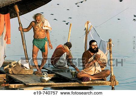 Man doing puja (Hindu devotional worship) by river Ganges at Kumba Mela festival View Large Photo Image Stock Photo - Man doing puja (Hindu devotional worship) by river Ganges at Kumba Mela festival. Fotosearch