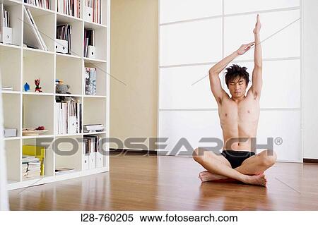 man doing yoga exercise View Large Photo Image Stock Photography - man doing yoga exercise. Fotosearch
