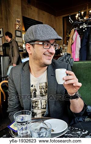Man drinking coffee in cafe, Vienna, Austria View Large Photo Image Stock Image - Man drinking coffee in cafe, Vienna, Austria. Fotosearch