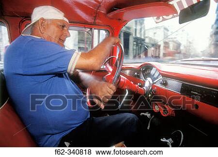 Man driving clssic american car on city streets. Havana. Cuba View Large Photo Image Stock Photo - Man driving clssic american car on city streets. Havana. Cuba. Fotosearch
