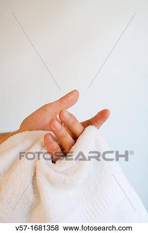 Man drying his hands with the towels. Close view. View Large Photo Image Stock Photo - Man drying his hands with the towels. Close view.. Fotosearch