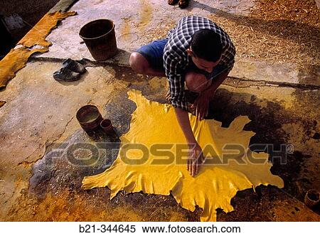 Stock Photography - Man dying leather at tanners? square. Fes. Morocco. Fotosearch